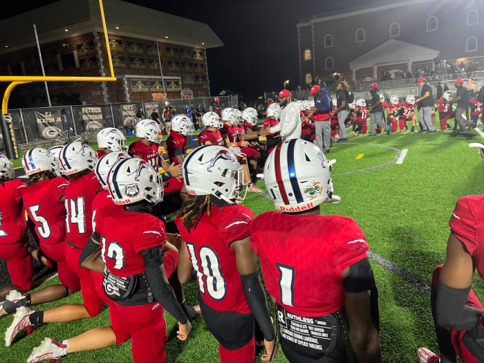 Chaminade-Madonna head coach Dameon Jones addresses his squad after the Lions topped American Heritage in South Florida on Friday night.